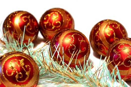 Composition Christmas red balls with gold pattern and tinsel