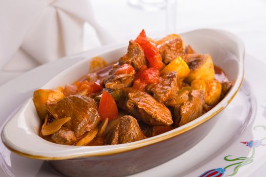 Beef Saute  with Tomatoes, mushrooms and onions served in Oval Baking Dish