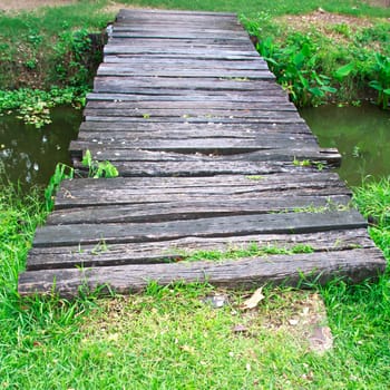 Old wooden bridge in a garden