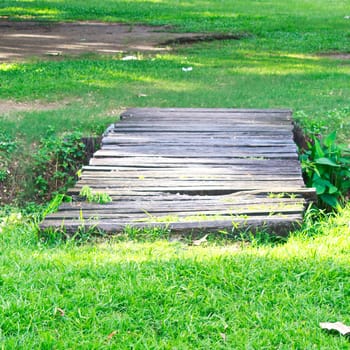 Old wooden bridge in a garden