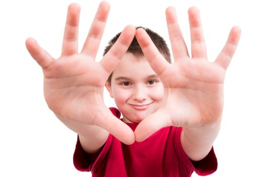 Young boy showing his hands and looking at you between them with confident, all ten fingers are visible