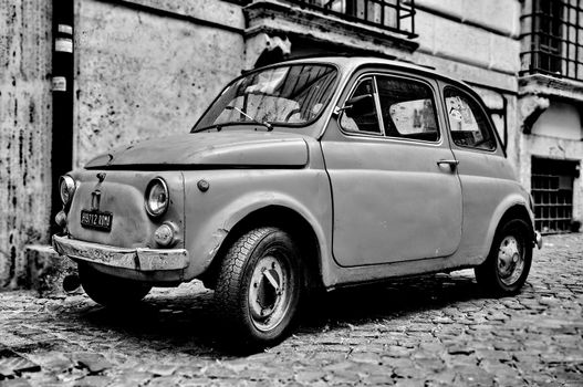 ROME - SEPTEMBER 20: A Fiat 500 on September 20, 2013 in Rome. Fiat 500 was produced by the Fiat company from 1957 to 75. Taken in Rome, Italy on September 20, 2013