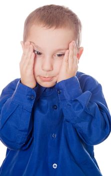 portrait of sad crying little boy covers his face with hands