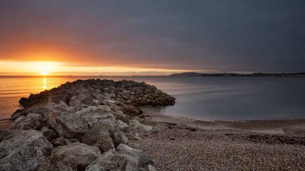 Sunset over the beach in Dorset