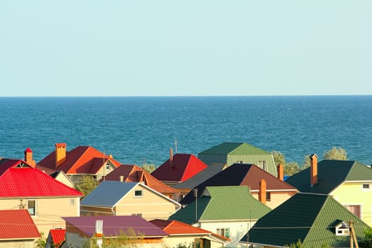 Colored roofs at the seaside with clear blue sky