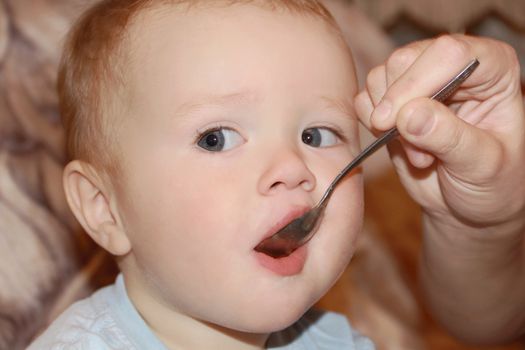 Image of cute eating baby 1 year