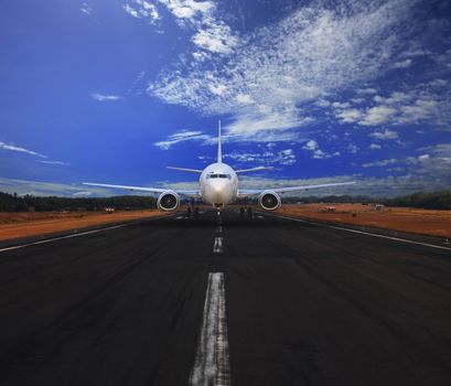 passenger air plane running on airport runway with beautiful blue sky with white cloud use for transport and traveling journey background