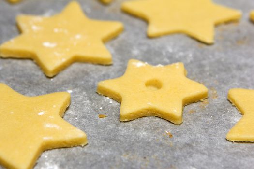 cookie cutter as stars raw on baking paper