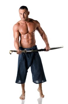 Martial art man: muscular man with kimono trousers and sword isolated on white background