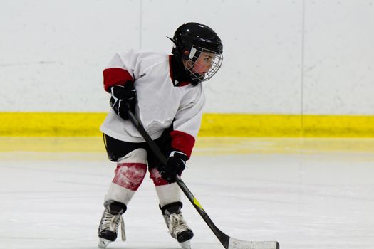 Child playing ice hockey