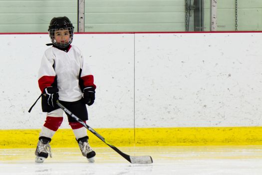 Child playing ice hockey