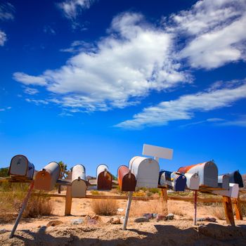 Grunge mail boxes in a row at California Mohave desert USA