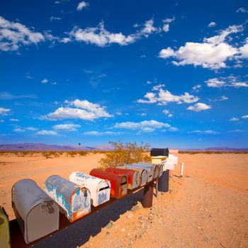 Grunge mail boxes in a row at California Mohave desert USA