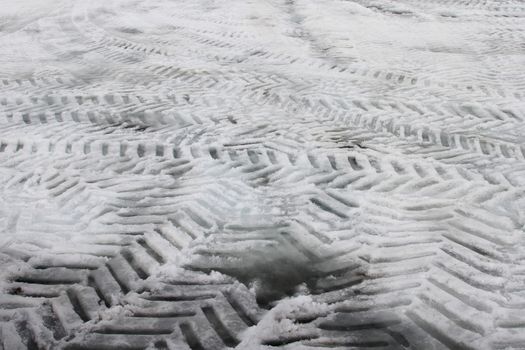 Tire Tracks in snow in various different directions