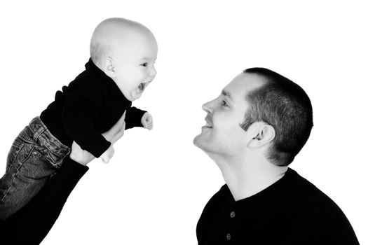 Baby boy and his dad against white background