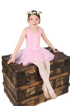Brunette ballet girl against a white background wearing pink