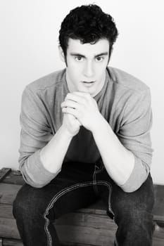 Attractive brunette male model in casual grey shirt