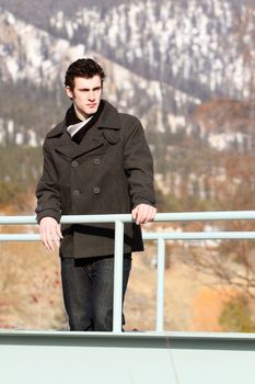 Attractive brunette male outside on a cold winters day