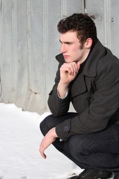 Attractive brunette male outside on a cold winters day