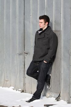 Attractive brunette male outside on a cold winters day