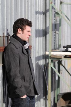 Attractive brunette male outside on a cold winters day