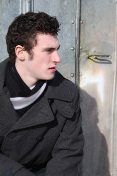 Attractive brunette male outside on a cold winters day