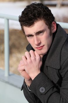 Attractive brunette male outside on a cold winters day