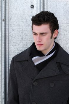 Attractive brunette male outside on a cold winters day