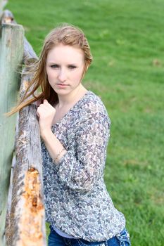 Beautiful blond model outdoors in rural setting natural light