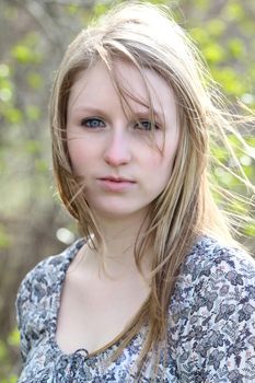 Beautiful blond model outdoors in rural setting natural light