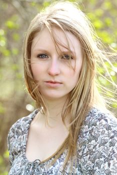 Beautiful blond model outdoors in rural setting natural light