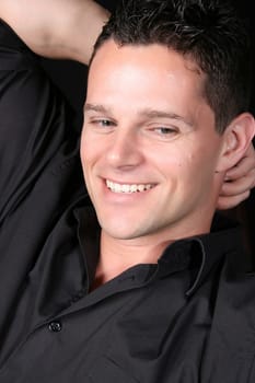 Attractive male model against a black background