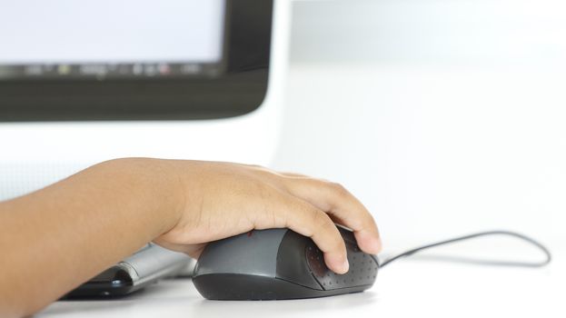 Children use mouse for control computer in class room