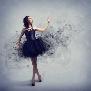 Young woman dancing for her abstract background