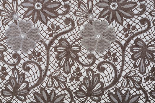 Brown flowers and leaves on a textil background