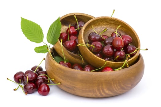 fresh cherries in a bowl on white background