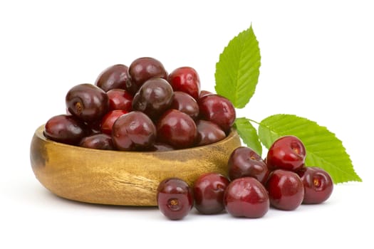 fresh cherries in a bowl on white background