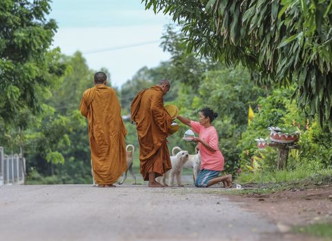 Loei province , Thailand - JULY 18: Every day very early in the morning, Thai people donated food to the monks on july 18, 2013 in Loei province , Thailand