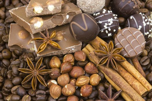 background with chocolate, coffee, spices and nuts