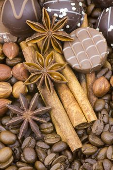 background with chocolate, coffee, spices and nuts