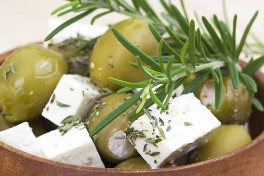 feta cheese and olives with herbs in olive oil