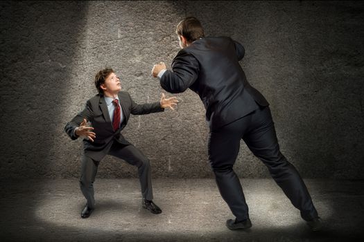 two businessmen fighting as sumoists, the concept of competition in business