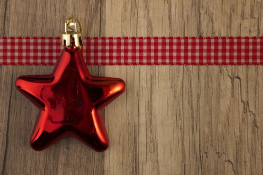 christmas decoration with christmas baubles red on wooden background 