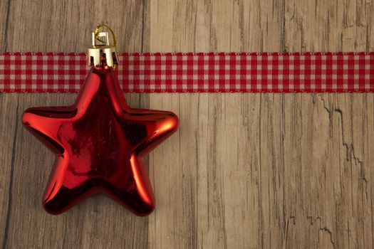 christmas decoration with christmas baubles red on wooden background 