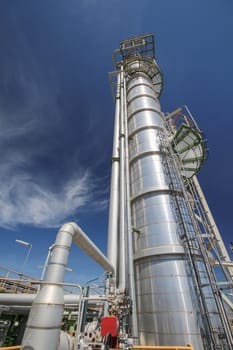 Chemical refinery tower in sunny day