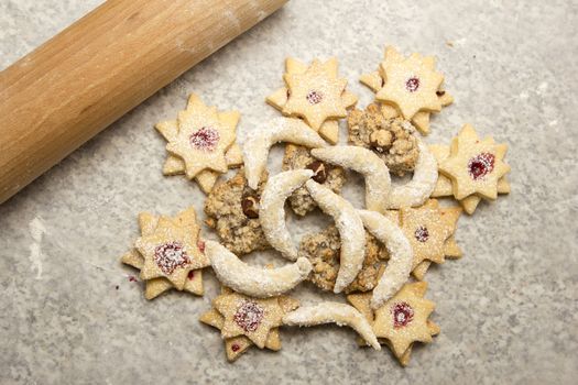 Vanillekipferl, macaroons with hazelnuts and cookie cutter with jam 