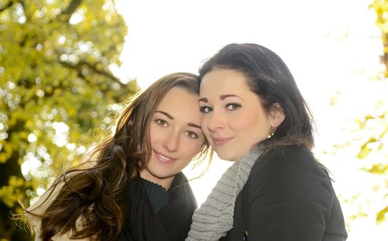  smiling women in autumn park