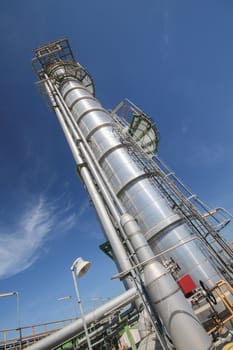 Chemical refinery tower in sunny day