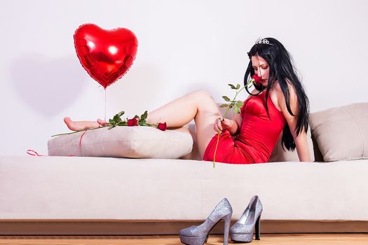 portrait of young woman on sofa, valentine day