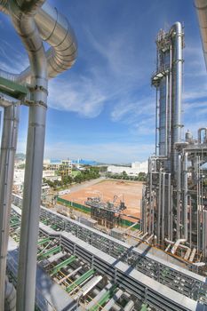 Chemical refinery tower in sunny day